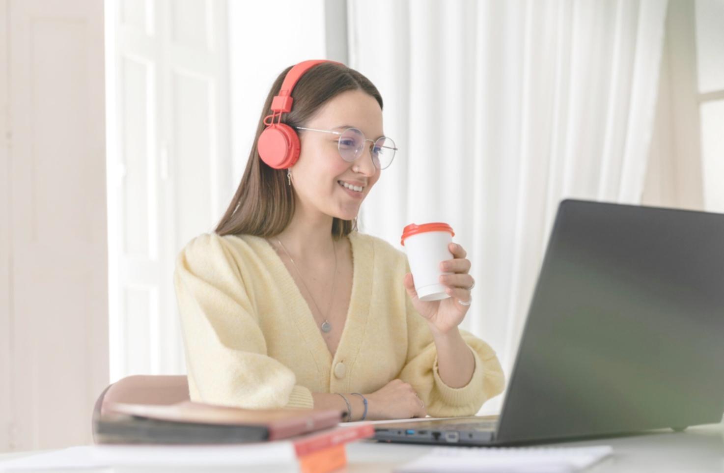 Person reviewing financial statements and making notes
